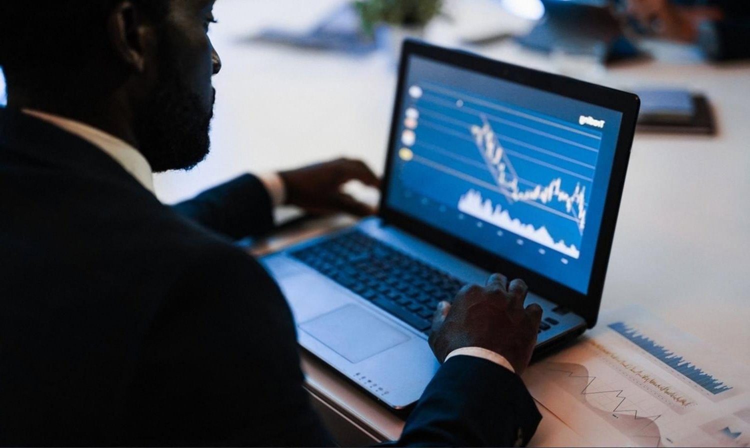 Financial reviewer analysing target company data on a laptop during due diligence