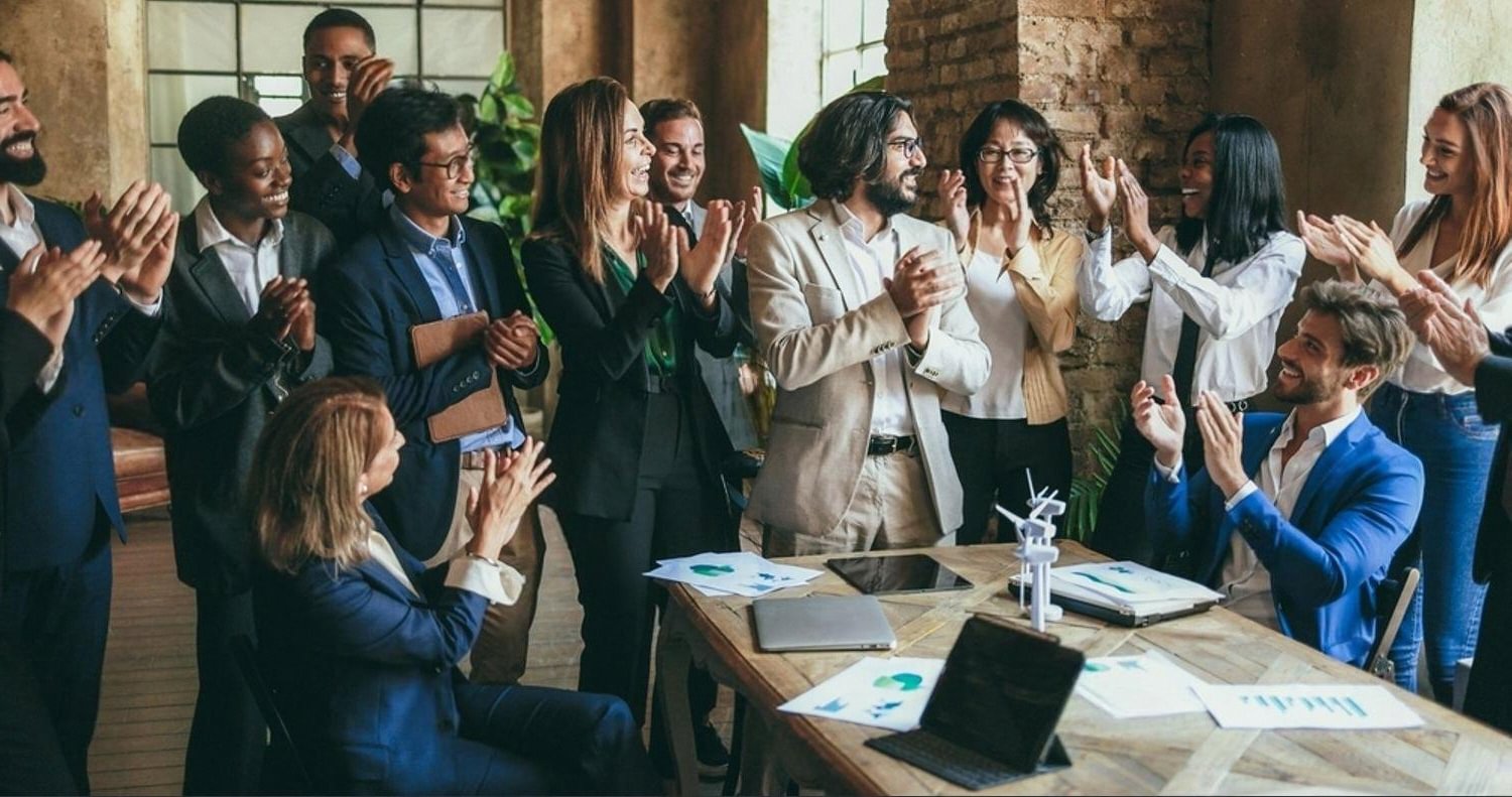 UAE business team celebrating after closing a well-vetted acquisition deal